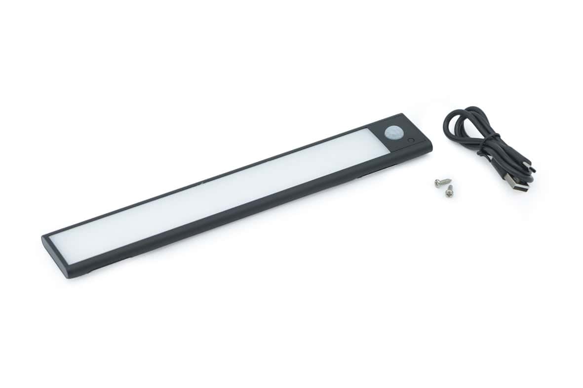LED sensor light with USB cable for easy charging and installation.