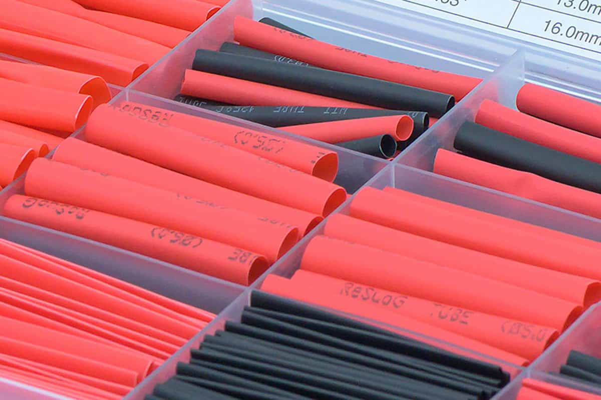 Bulk heat shrink tubing in black and red for electrical insulation and protection.