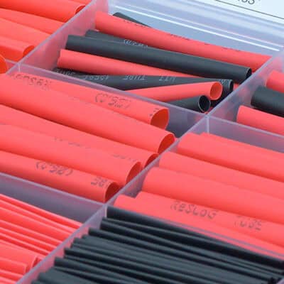Bulk heat shrink tubing in black and red for electrical insulation and protection.
