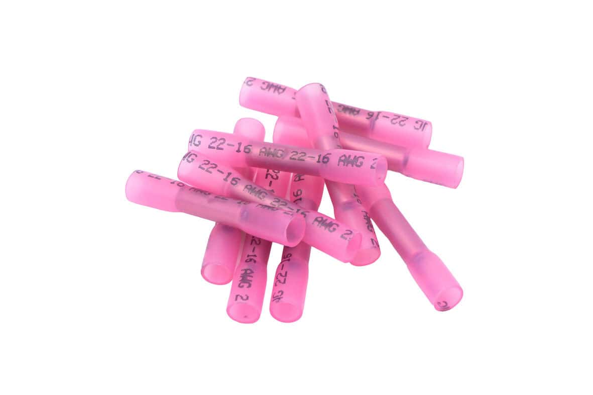 Pink heat shrink cable connectors for electrical wiring.